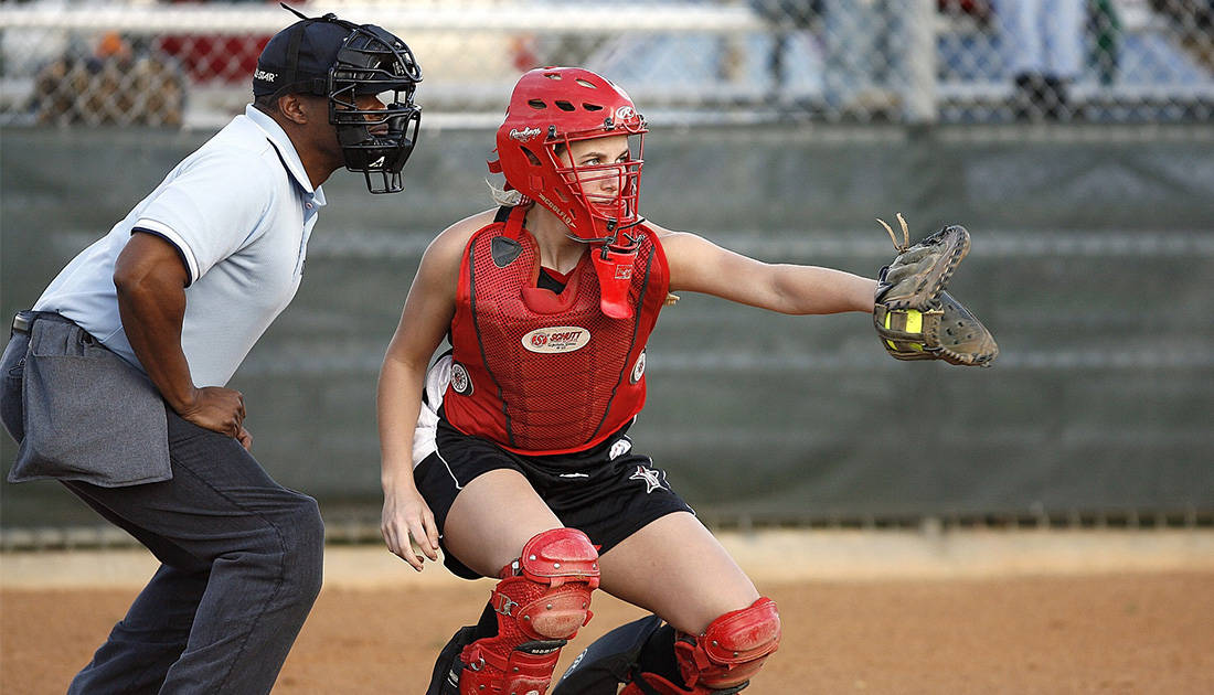 fastpitch-catcher-in-game Fastpitch catcher catching a softball